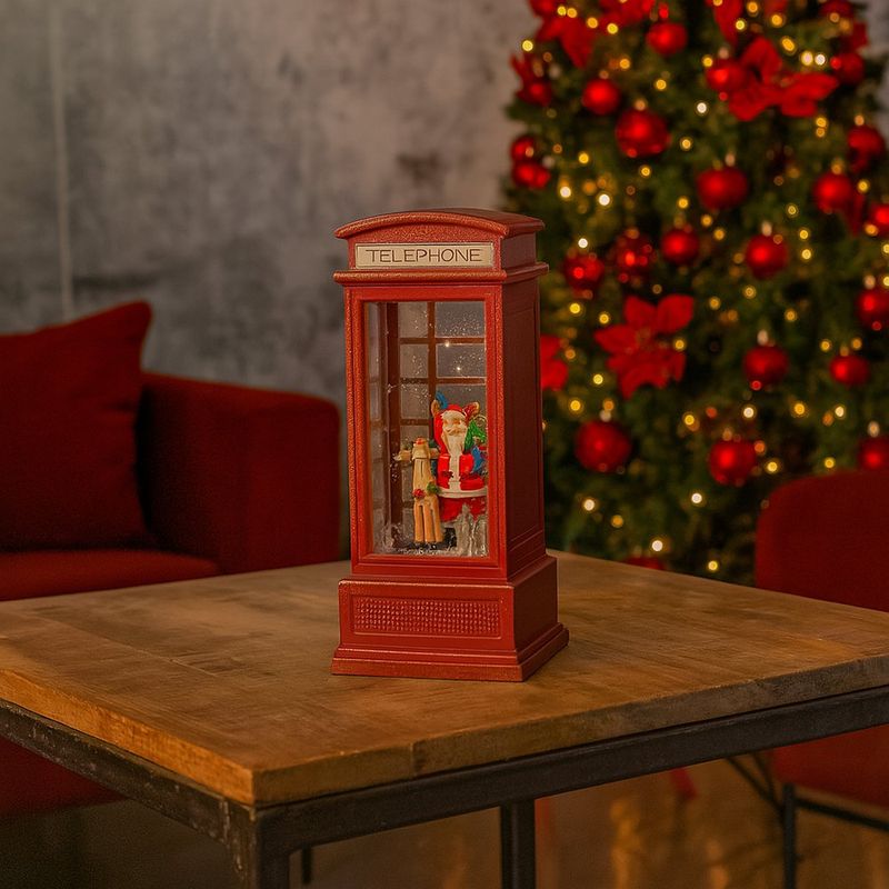 Cabina telefónica navideña con figura de Santa Claus