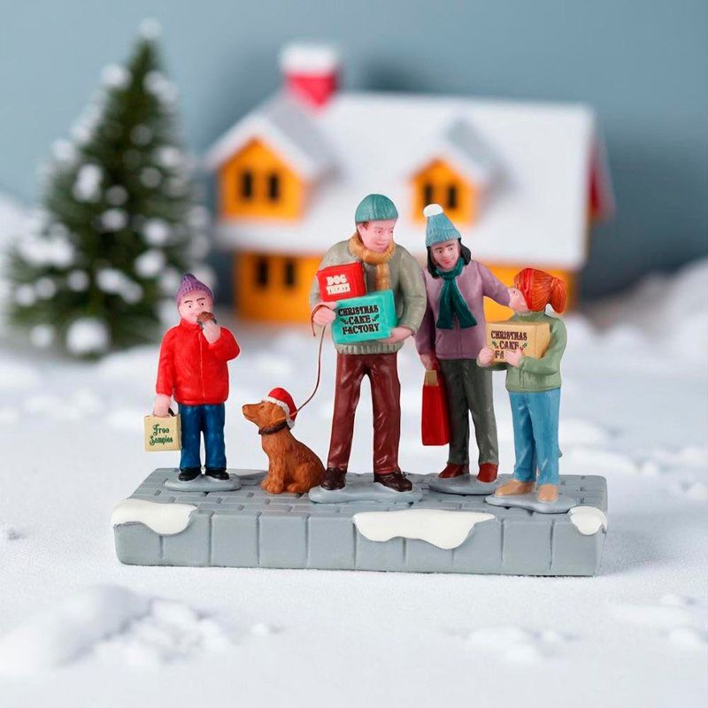 Figura de Familia Comprando Pastelillos para Villa Navideña