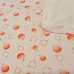 Set de Frazada y Cojín para Bebé con Estampado de Naranjas