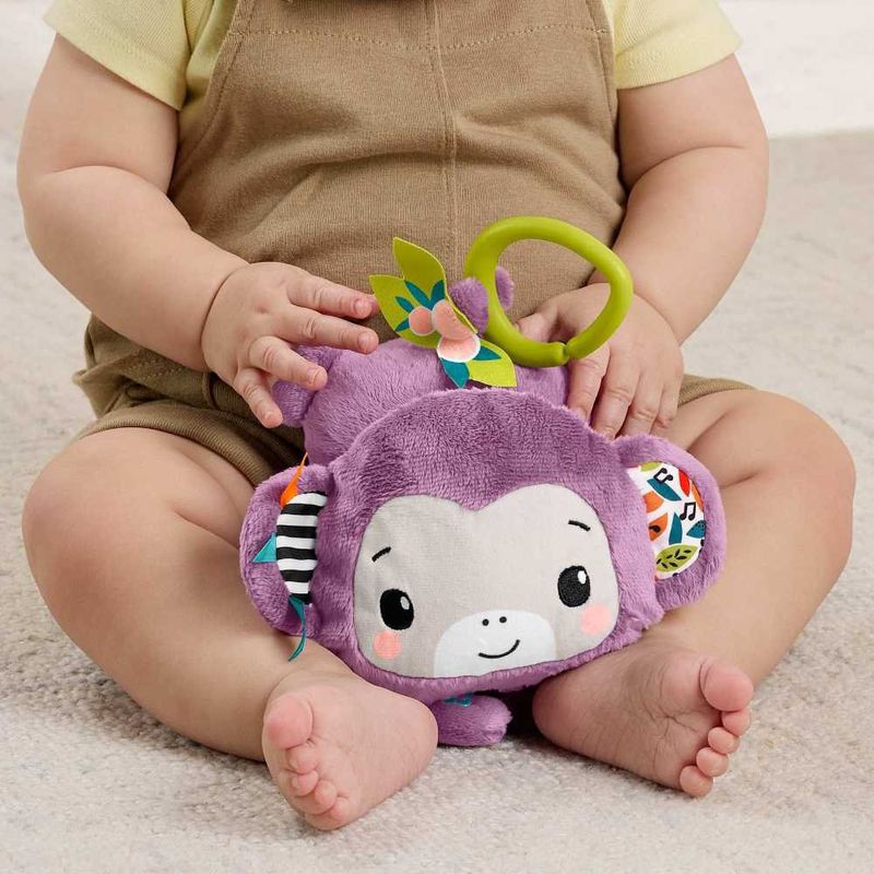 Juguete Colgable para Carruaje Mono Musical Purple Monkey con Sonidos Sensoriales