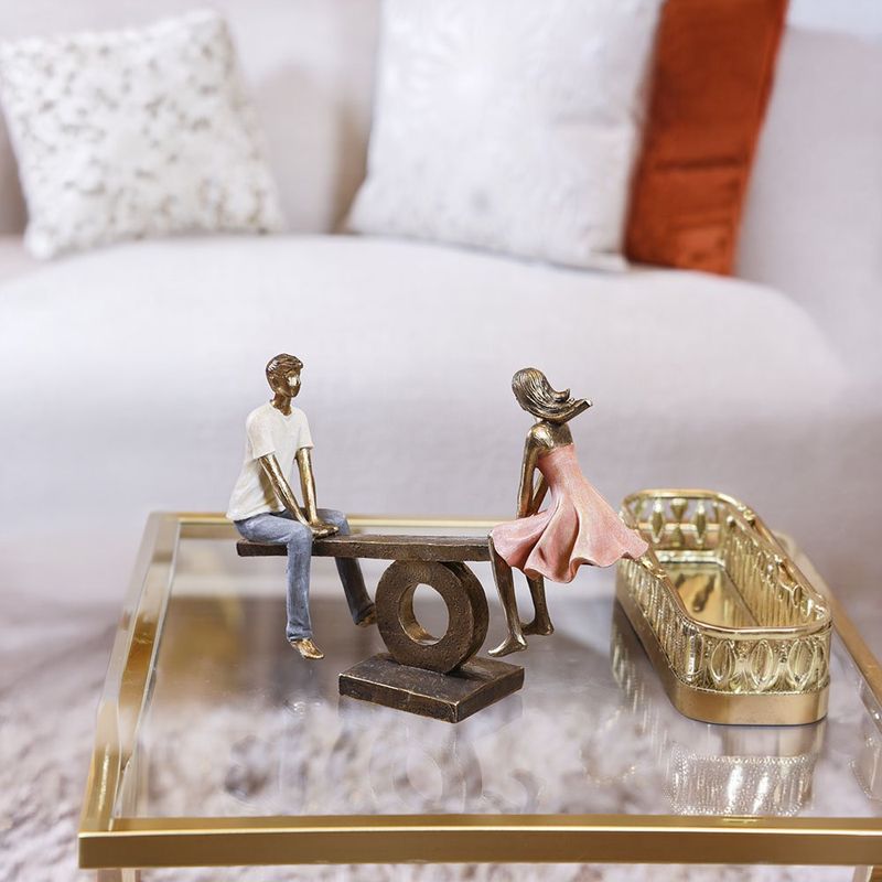 Figura Decorativa de Pareja en Sube y Baja Poliresina y Piedra 30.5 Cm Tono Bronce y Durazno